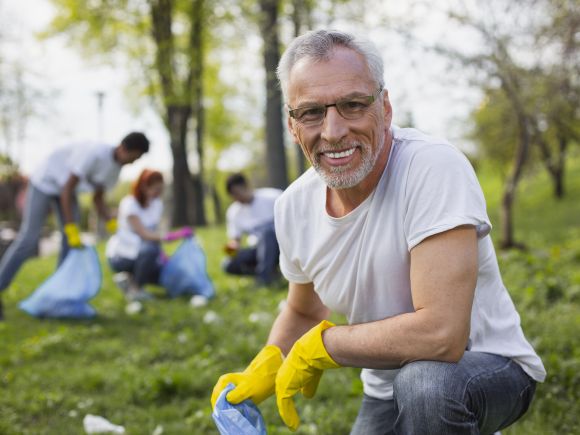 Smiling man collected rubbish