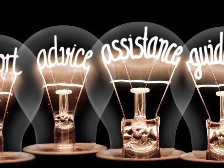 Lightbulbs showing the words support advice assistance and guidance